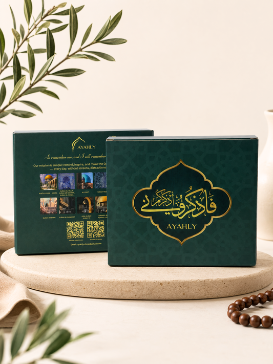 Ayahly Quran speaker magnet gift box in dark green with gold calligraphy and the design card selection shown on the back