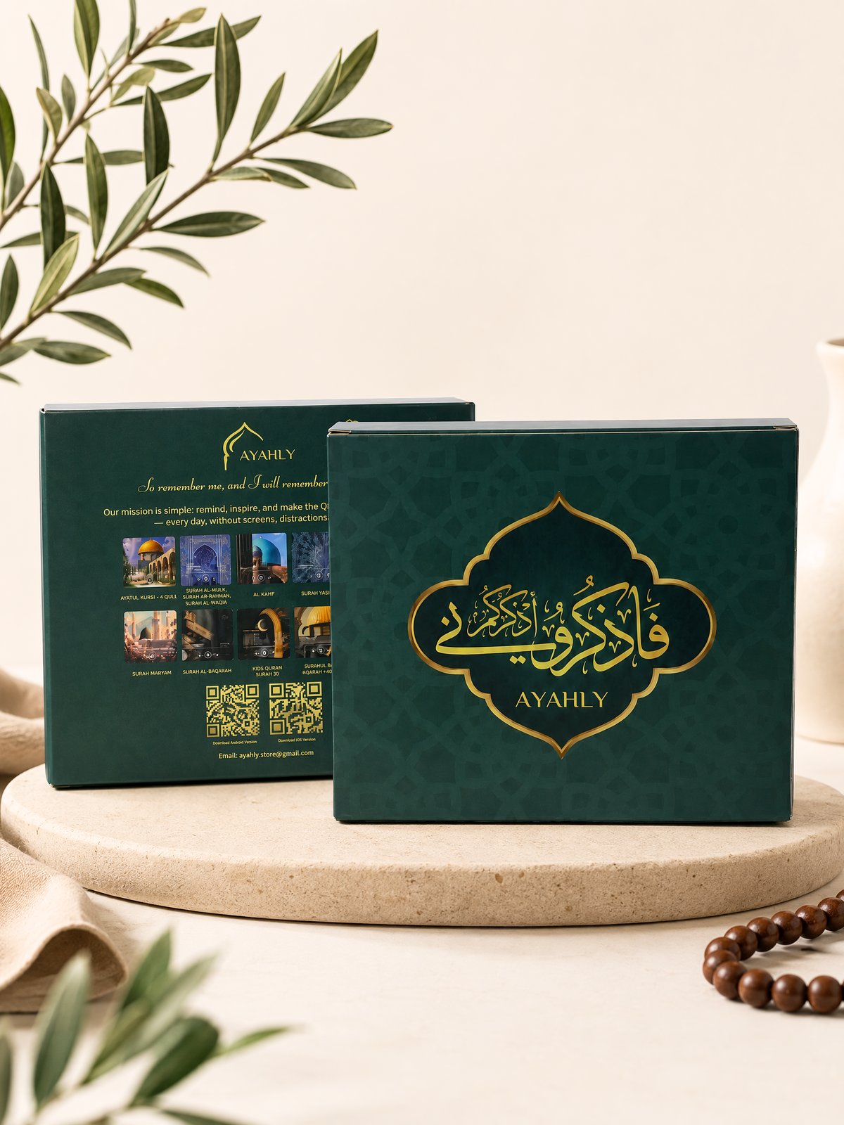 Ayahly Quran speaker magnet gift box in dark green with gold calligraphy and the design card selection shown on the back