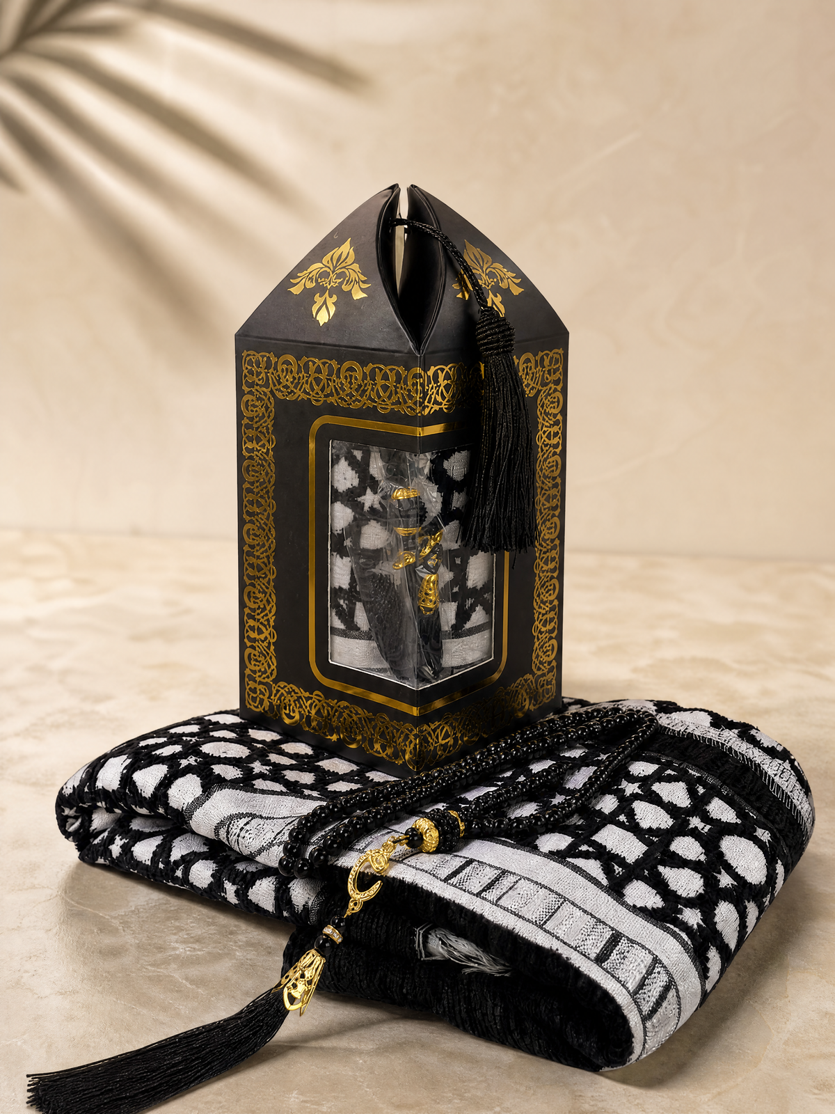 Black prayer mat and tasbih gift set with a gold-trimmed lantern-shaped gift box