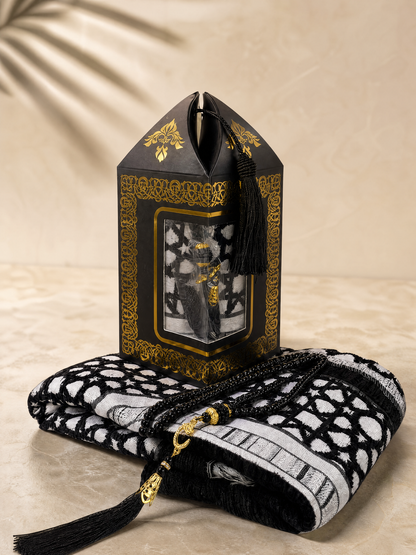 Black prayer mat and tasbih gift set with a gold-trimmed lantern-shaped gift box