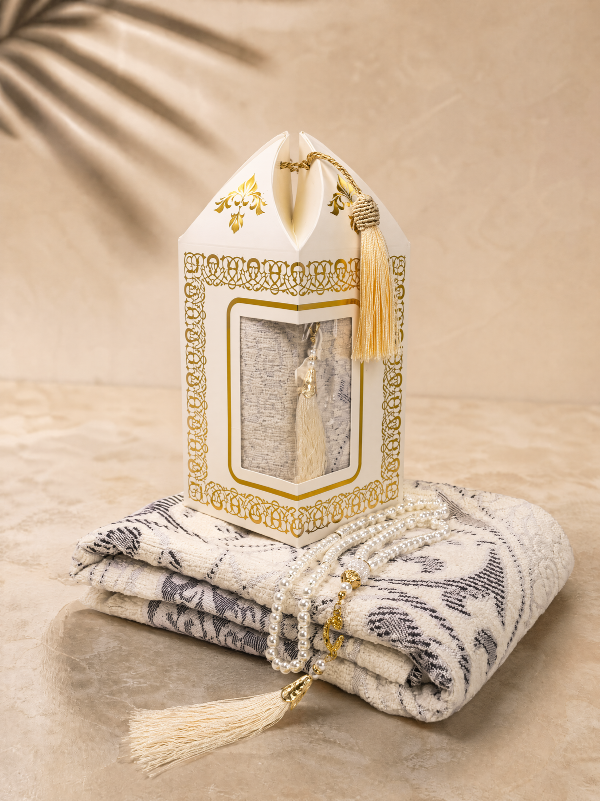 Cream white prayer mat and tasbih gift set with a lantern-shaped gift box and matching tassel